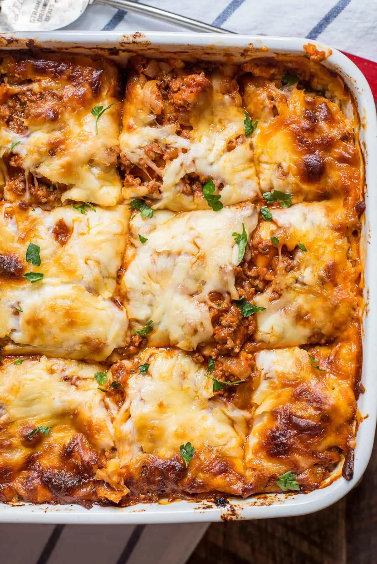Layers of cottage cheese lasagna topped with golden melted cheese and tomato sauce