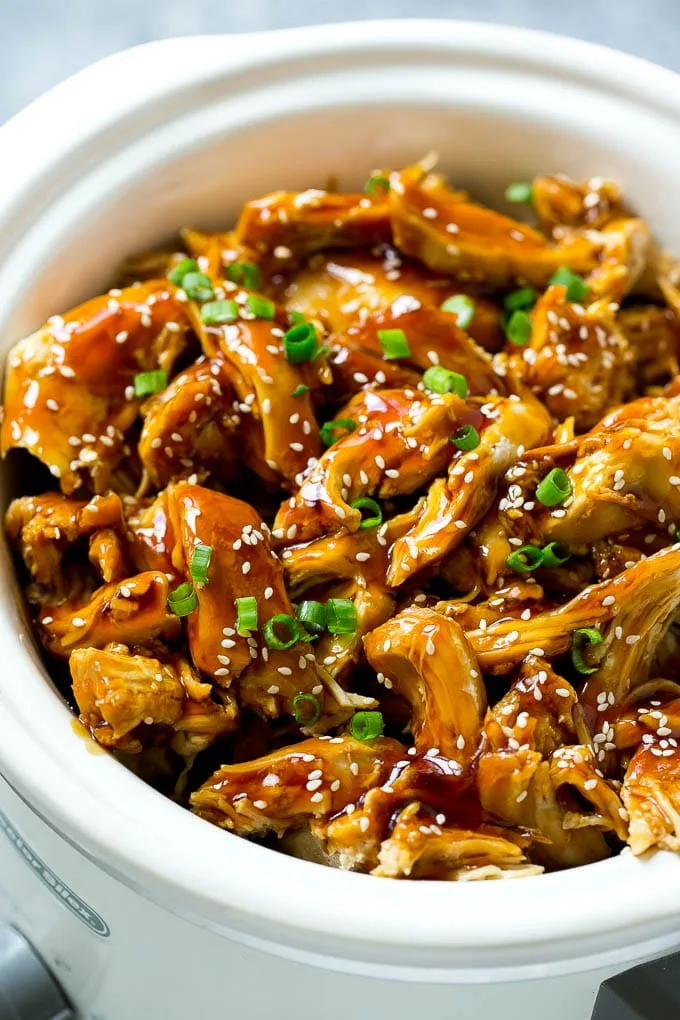 Tender teriyaki chicken thighs glazed with sauce, served over steamed white rice